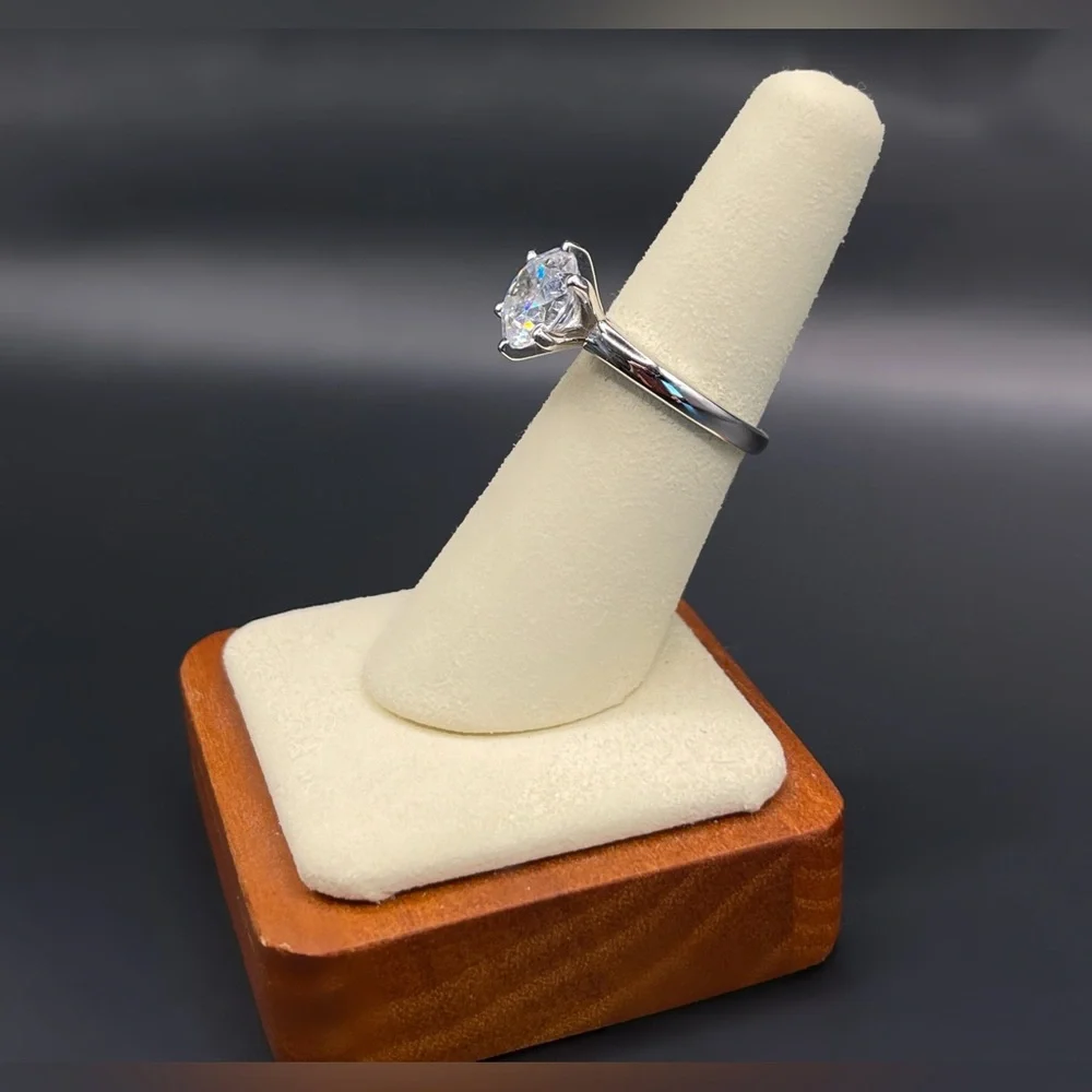Two (2) carat cz solitaire in a 925 sterling silver setting. Size 6.25.